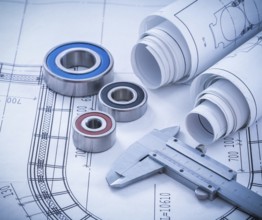 Close up image of construction drawings slide caliper rolling bearings on blueprint architecture