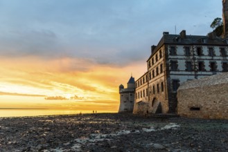 Dramatic sunset on Mont Saint Michel, Normandy, France, Europe