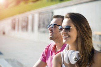 Young happy smiling couple having date outdoors