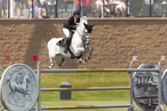 Carly Campbell-Cooper of Canada and riding Baretino, compete in the 1.60m Grand Prix during The