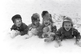 Winter in the 1950s. Children are playing in a park in Stockholm. They don't seem to be freezing.