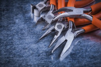 Sharp insulated electric pliers nippers horizontal version electricity concept