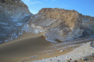 Late afternoon sun casting shadows on rocks in the Libyan desert white desert, Farafra, Egypt,