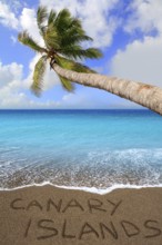 Brown beach sand with written word Canary islands