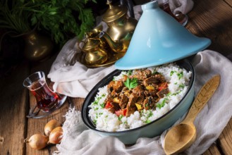 Tajin beef stew with rice, peppers and sesame seeds