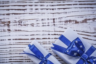 Packed gift containers on vintage wooden board holidays concept
