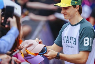 MELBOURNE, AUSTRALIA - MARCH 13: Oscar Piastri of Australia and McLaren Formula 1 Team with fans