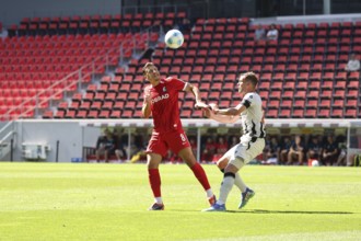 Maximilian Eggestein (SC Freiburg) wins the header duel against Fabian Frei (FC Basel) during the