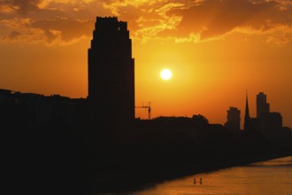 The sun sets behind the Mainplaza Hotel in Frankfurt am Main, Frankfurt am Main, Hesse, Germany,