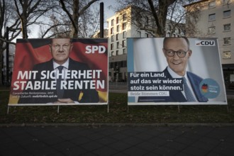 Election posters of the candidates for chancellor Olaf Scholz (SPD, left) and Friedrich Merz (CDU,