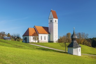 The Gothic pilgrimage church of St Florian with the baroque fountain chapel, Frasdorf, Chiemgau,