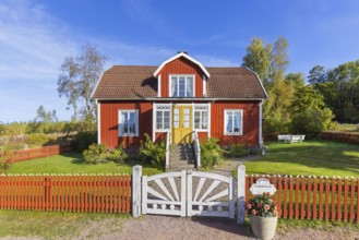 Katthult, red wooden farm house with fence from Astrid Lindgren's tales about Emil of Lönneberga at