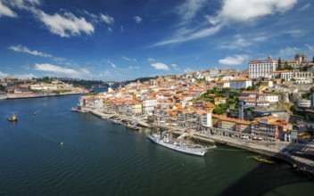 Aerial view of Porto city and Douro river with moored sailling ship from Dom Luis bridge I. Porto,