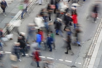 Passers-by crossing a street, long exposure, Germany, Europe