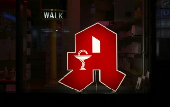 Night shot, logo, red neon sign, sign, pharmacy with Aesculapian staff, Aesculapian staff,