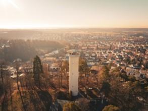 Panoramic view of a town with a central tower surrounded by autumnal colours, Böblingen, Germany,