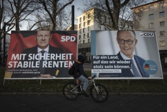Election posters of the candidates for chancellor Olaf Scholz (SPD, left) and Friedrich Merz (CDU,