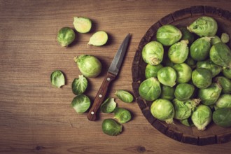 Fresh Brussels sprouts, raw, top view, on a wooden table, no people