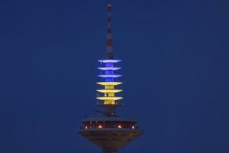 The Europe Tower in Frankfurt am Main shines in the Ukrainian national colours yellow and blue on