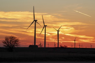 Wilson, Kansas - Wind turbines are silhouetted against the sunset in central Kansas.