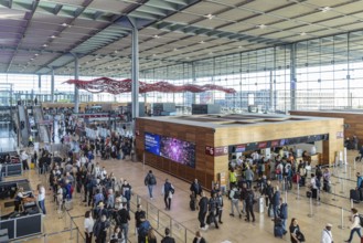 Berlin-Brandenburg BER Airport. Passengers in Terminal 1 waiting for check-in and security control