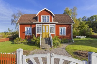 Katthult, red wooden farm house with fence from Astrid Lindgren's tales about Emil of Lönneberga at
