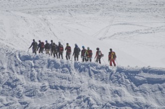 Rope team on the glacier of Mont Blanc (4805 m) . in the Savoy Alps, in the department of