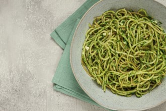 Spaghetti with pesto sauce, homemade, no people