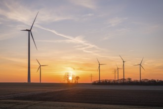 Wind turbines in an open landscape at sunset, near Ulm, Swabian Alb, Baden-Württemberg, Germany,