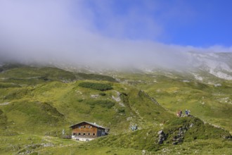 Giglachseehütte and fog over the mountain ridge, Schladming, Styria, Austria, Europe