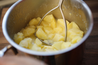 Swabian cuisine, preparation of beef roulade with pine nuts, making mashed potatoes, potato masher,