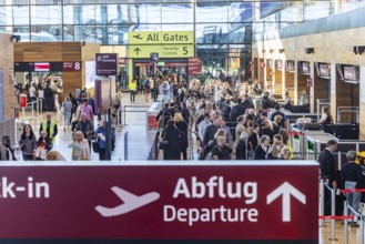 Berlin-Brandenburg BER Airport. Passengers in Terminal 1 waiting for check-in and security control