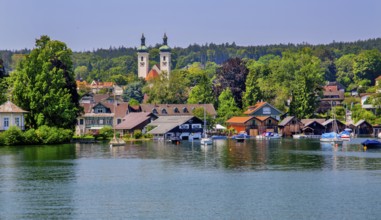 Waterfront with boathouses and towers of the parish church, Tutzing, Lake Starnberg, Bavarian