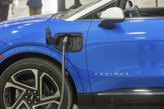 Detroit, Michigan USA - 10 January 2025 - The Chevrolet Equinox EV, plugged into a charging station