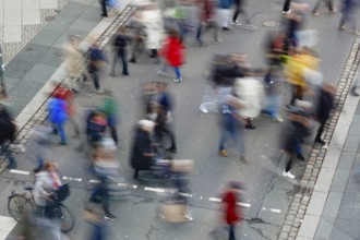 Passers-by crossing a street, long exposure, Germany, Europe