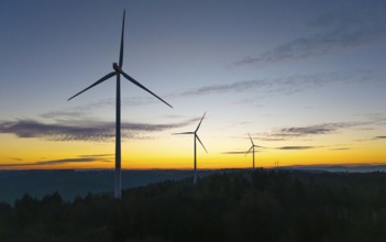 Wind turbines at dawn against a slightly cloudy sky, wind farm, Rems Valley, Baden-Württemberg,
