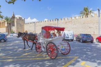 Tourists riding in a horse drawn carriage, Alcudia, Mallorca, Balearic Islands, Spain, Europe