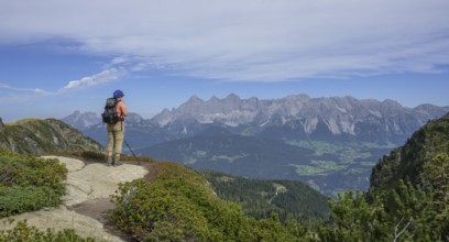 Woman looking towards the Dachstein massif, Schladming, Styria, Austria, Europe
