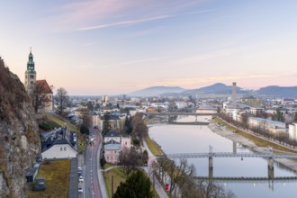 View of the Mülln parish church, Salzach with Müllnersteg, sunset, Salzburg City, Salzburg