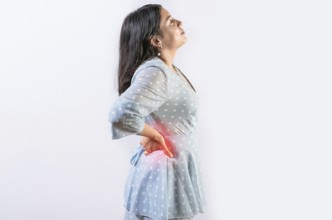 Suffering girl with back pain isolated. Young woman with spine problems isolated. Person with back