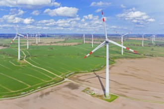 Aerial view over wind turbines at wind park, windfarm in Schleswig-Holstein, Germany, Europe