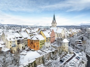 Aerial view of the snow-covered town of Engen in Hegau on a winter morning with the Church of the