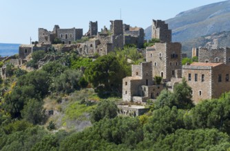 Detailed view of historic stone houses of a hilltop village, residential towers, Vathia, Ithylo,