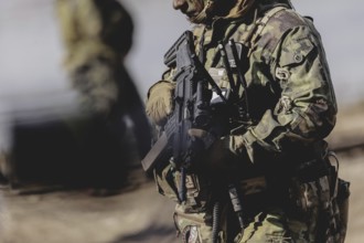 A soldier with a rifle, taken during the military exercise 'Wettiner Schwert' with German and Czech