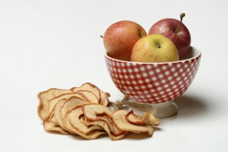 Apple rings and apples in peel, dried fruit