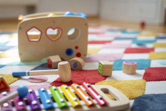Young child toy concept: Close up of stylish wooden toddler toy in nursery