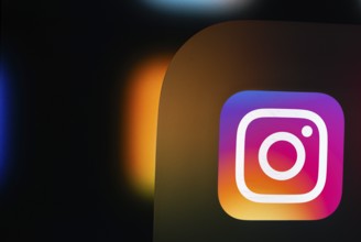 A close up of an iPad screen displaying the instagram app icon