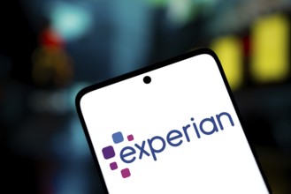 experian logo is displayed on smartphone. Experian plc is a multinational data analytics and
