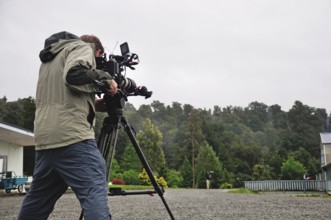 Cameraman at work in a housing area