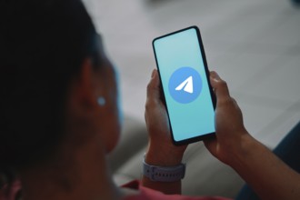 In this photo illustration, the Telegram logo is displayed on a smartphone screen